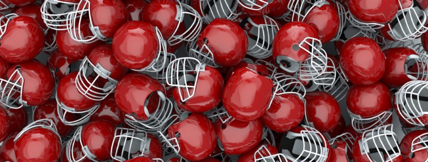 Pile of red helmets that can spread head lice